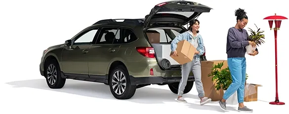 A mom and daughter unpack their SUV with home furnishings.